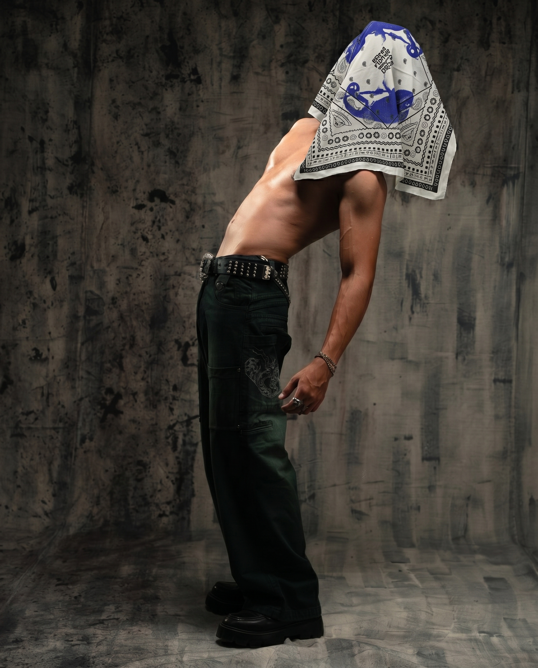 Person wearing a bandana over their head with a textured gray background